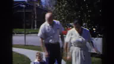 Las Vegas (1958): Man And Woman Walking With Child On Grassy Sidewalk With Car And