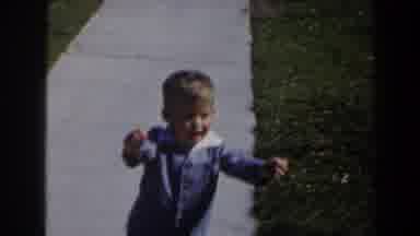 Las Vegas (1958): Toddler Wearing Blue Suit Walks To Woman Wearing Grey Dress On A