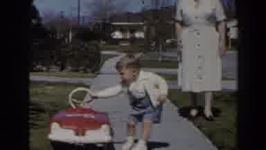 Las Vegas (1958): Woman Watching Child Playing With Stroller In Front Of Home