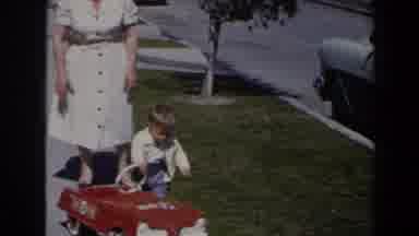 Las Vegas (1958): Woman Wearing His Dress Helps Toddler Wearing White Sweater Get