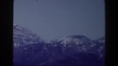 Las Vegas (1958): Driving Past A Big Group Of Mountains That Are Close
