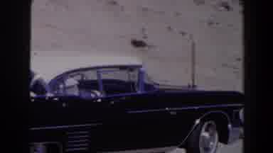 Las Vegas (1958): Cars Passing The Road Woman In Glasses In Front Of The Car