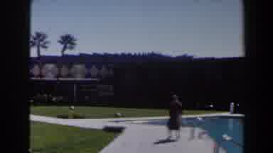 Las Vegas (1958): Person In Red Clothes Walks By The Pool With Beautiful Scenery