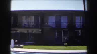 Las Vegas (1958): Driving Past An Apartment With A Pool On A Sunny Day
