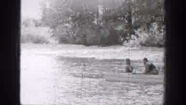 Chelan Washington (1939): Lake And A Boat With Two Men Fishing And A Rough Road