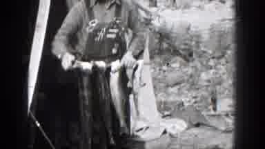 Chelan Washington (1939): Fishermen In The Forest Carrying Their Fish And Smiling