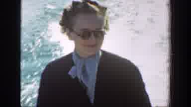 Chelan Washington (1939): A Female Tourist On A Boat Being Rode By A Male