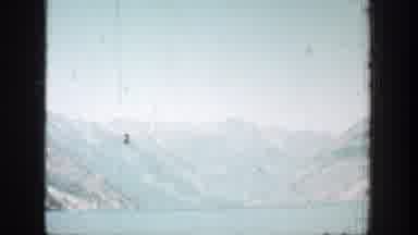 Chelan Washington (1939): A Blurred View Of Mountains And Hills Covered By A Pilot