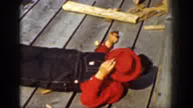 Chelan Washington (1939): Person Wearing Blue Overalls Lies On Wooden Plank Floor