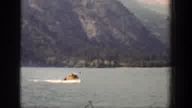 Chelan Washington (1939): Person Wearing Yellow Jacket Rides In Small White Boat
