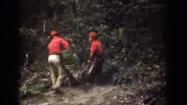 Chelan Washington (1939): Two Men In Red Clothes And Helmets Climbing A Dead