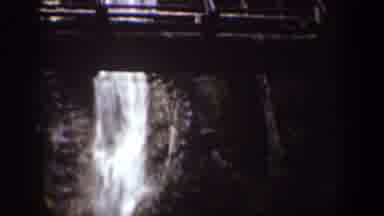 Chelan Washington (1939): View Of Waterfall And Person Crossing Wooden Bridge On A
