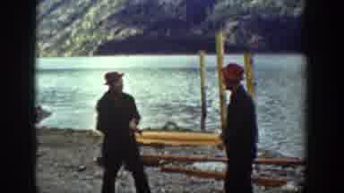 Chelan Washington (1939): Two Men Getting Into A Fist Fight In Front Of A Lake