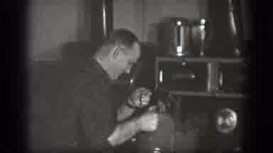 Chelan Washington (1939): Man Pouring Liquid From Large Kettle Into Pot Resting On