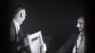 Chelan Washington (1939): A Group Of Men Playfully Fighting With A Chair As One