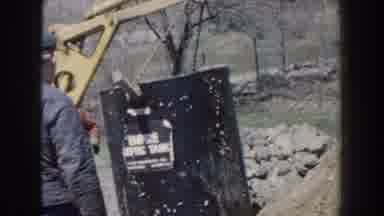 Nebraska-1959: Men Installing Septic Tank Using Backhoe and Crane