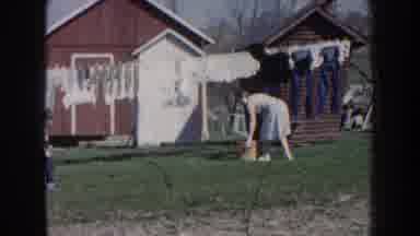 Nebraska (1959): A Woman Hangs Clothes On A Clothesline Followed By A Woman
