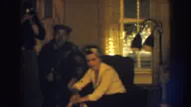 Nebraska (1959): Some People In A Room Of A House And A Woman And Two Men