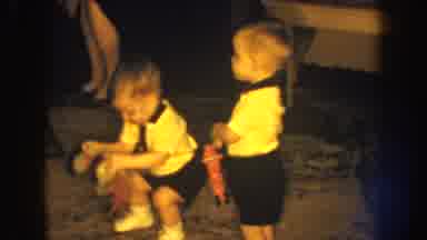 Nebraska (1959): Twin Boys Wearing Matching Yellow Shirts And Black Shorts Play On
