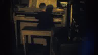 Nebraska (1959): Little Boy Playing Piano Woman On Floor Covering Face Sobbing