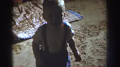 Nebraska (1959): Smiling Baby Walking With Blue Overalls On