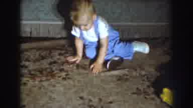 Nebraska (1959): Child Crawling On The Living Room Floor And Looking At Camera And