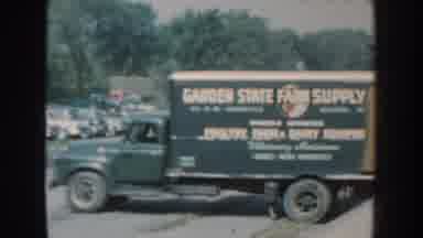Nebraska (1959): The Outside Of A Poultry Exhibition At A Large Center And Trucks