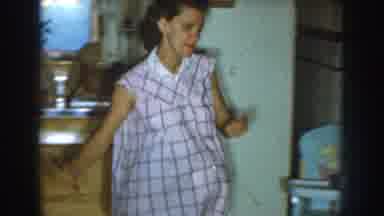 Nebraska (1959): Pregnant Walking Faster Inside The House And Child With Her Toy