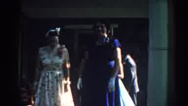Nebraska (1959): Group Of Well-Dressed People Walking Out Of The House After