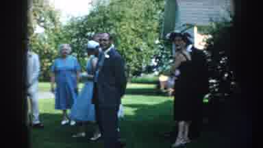 Nebraska (1959): View Of White Three Tiered Wedding Cake And People Standing On