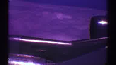 Los Angeles California (1969): Aerial View Of Plane Wing Flying Over White Clouds