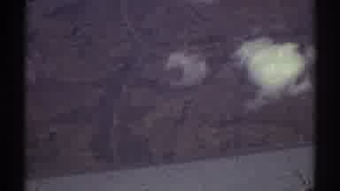 Los Angeles California (1969): Plane Flying Over Mountains And Hills With White