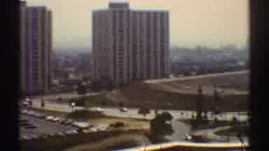 Los Angeles California (1969): View Of White Building And Yellow Car Driving In
