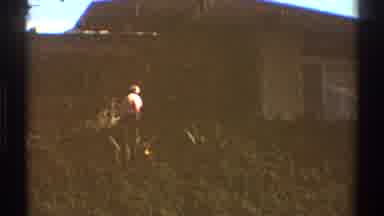 Los Angeles California (1969): Person Wearing White Shirt Walks Into A White House