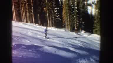 Aspen Colorado (1961): People Skiing Downhill On A Bright Sunny Day