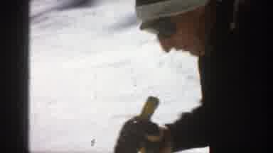 Aspen Colorado (1961): A Man Is Jet skiing On An Icy Land Surrounded By Rocks