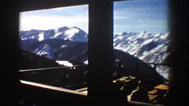 Aspen Colorado (1961): Men Working On A Structure Surrounded By Great Mountains