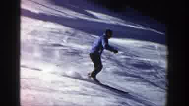 Aspen Colorado (1961): Person Wearing Blue Jacket Skis Downhill On A Bright Sunny