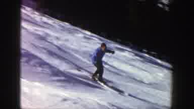 Aspen Colorado (1961): Man Skiing Down A Tree Lined Trail Passing Other People In