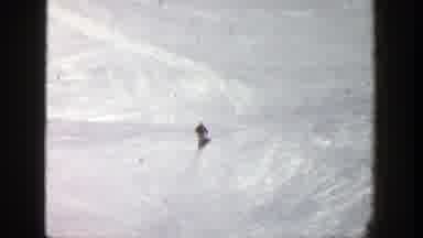 Aspen Colorado (1961): Person Wearing Black Jacket Skis On Snow Covered Mountain