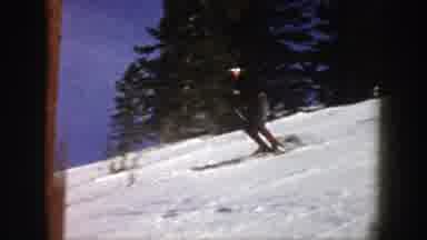 Aspen Colorado (1961): Man In A Black Shirt And Red Socks Skiing On The Snow On A
