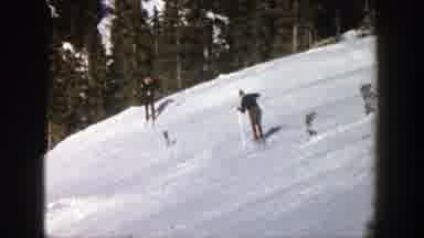 Aspen Colorado (1961): Man Skiing On An Ice Plain With A Forest In The Background