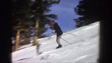 Aspen Colorado (1961): White Man In A Black Jacket And Grey Pants Silkily Skiing