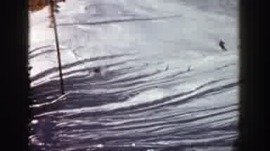 Aspen Colorado (1961): Person Falls While Skiing Downhill On A Bright Sunny Day