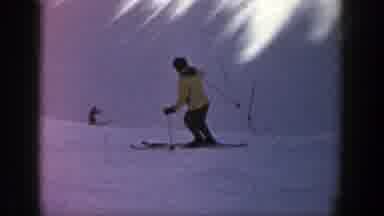 Aspen Colorado (1961): Person Wearing Yellow Jacket Skis On A Clear Day