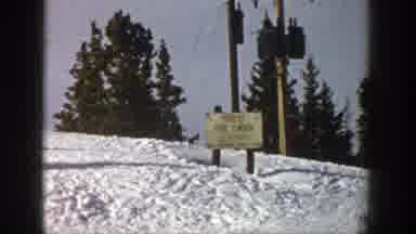 Aspen Colorado (1961): Person Wearing Brown Pants Makes Small Jump While Skiing On