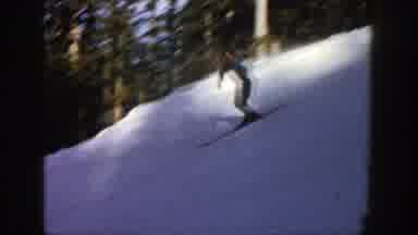 Aspen Colorado (1961): Two Alpine Snow Skiers Gently Gliding Down A Ski Slope
