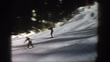 Aspen Colorado (1961): Two Men Skiing Down A Mountain Side