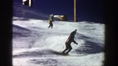 Aspen Colorado (1961): People Skiing On Snow-Covered Mountain At Ski Resort
