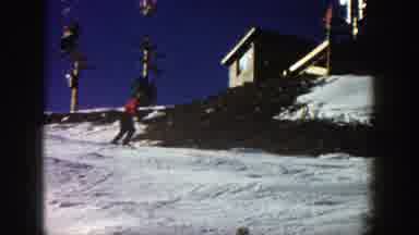 Aspen Colorado (1961): People Skiing On Slope Near Building And Ski Lift Exit